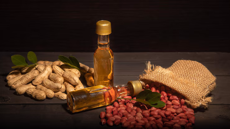 peanut-oil-small-bottles-with-peanuts-shell-organic-grains_248736-145
